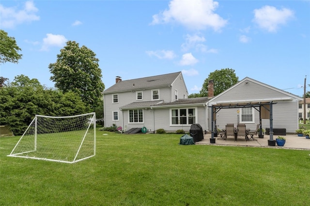 15 Metcalf Dr, Cumberland, RI 02864 - rear view of property with a patio area, a chimney, and an area for sports