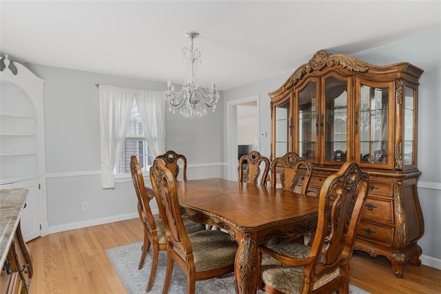 15 Metcalf Dr, Cumberland, RI 02864 - dining room with a chandelier and light wood-style floors