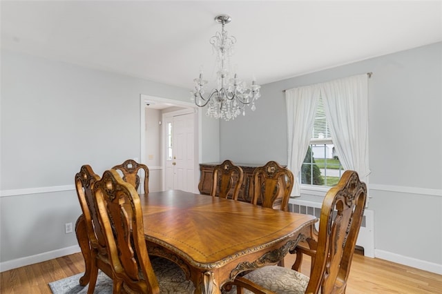 15 Metcalf Dr, Cumberland, RI 02864 - dining room with a chandelier, light wood finished floors, and radiator