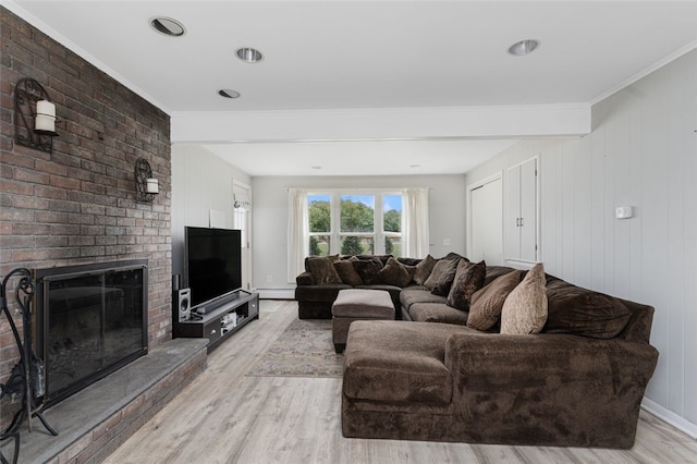 15 Metcalf Dr, Cumberland, RI 02864 - living room with light wood-type flooring, ornamental molding, a fireplace, and a baseboard heating unit