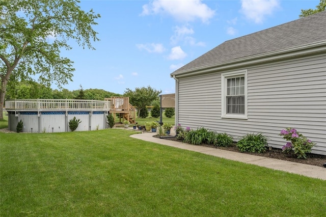 15 Metcalf Dr, Cumberland, RI 02864 - view of green lawn featuring a wooden deck, an outdoor pool, and stairs