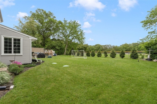 15 Metcalf Dr, Cumberland, RI 02864 - view of yard featuring an area for sports and view of wooded area