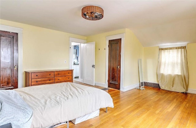 796 Pontiac Ave, Cranston, RI 02910 - bedroom featuring baseboards, light wood finished floors, and connected bathroom