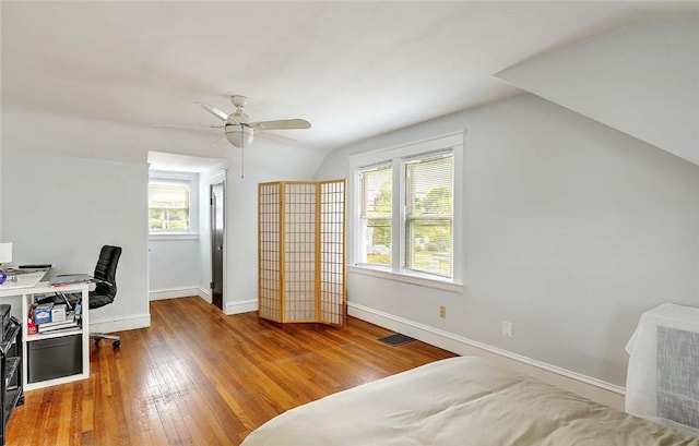 796 Pontiac Ave, Cranston, RI 02910 - bedroom featuring lofted ceiling, wood finished floors, multiple windows, baseboards, and an office area