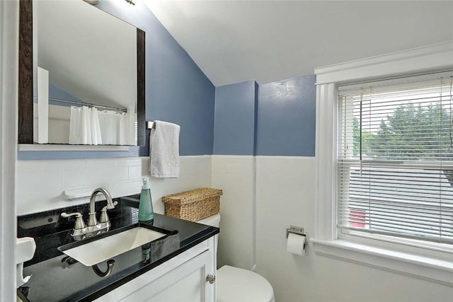 796 Pontiac Ave, Cranston, RI 02910 - bathroom with vaulted ceiling, vanity, toilet, backsplash, and curtained shower