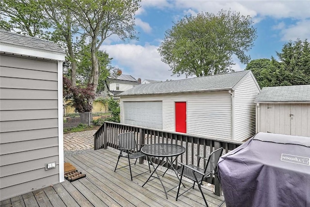 796 Pontiac Ave, Cranston, RI 02910 - deck with an outbuilding, a detached garage, a grill, and outdoor dining area