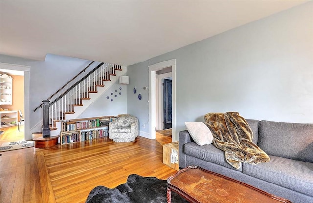 796 Pontiac Ave, Cranston, RI 02910 - living room with wood finished floors, stairway, and baseboards