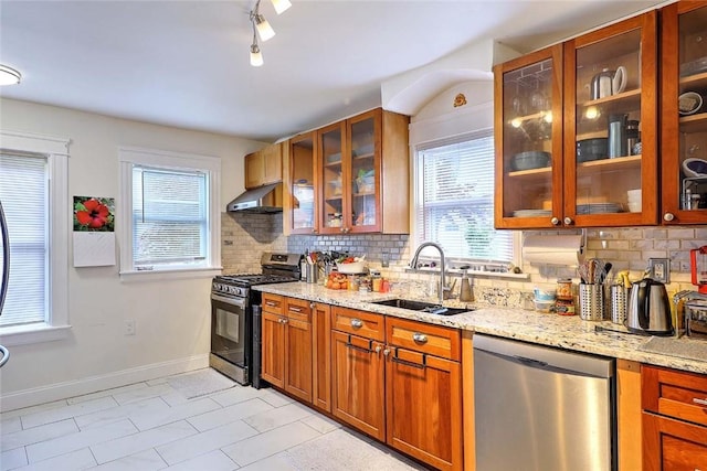 796 Pontiac Ave, Cranston, RI 02910 - kitchen with stainless steel appliances, a sink, wall chimney exhaust hood, tasteful backsplash, and light stone counters