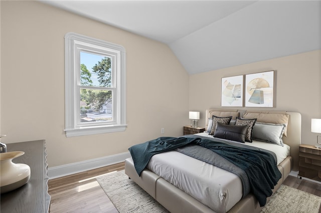62 Fenner Ave, East Providence, RI 02915 - bedroom featuring lofted ceiling, wood finished floors, and baseboards