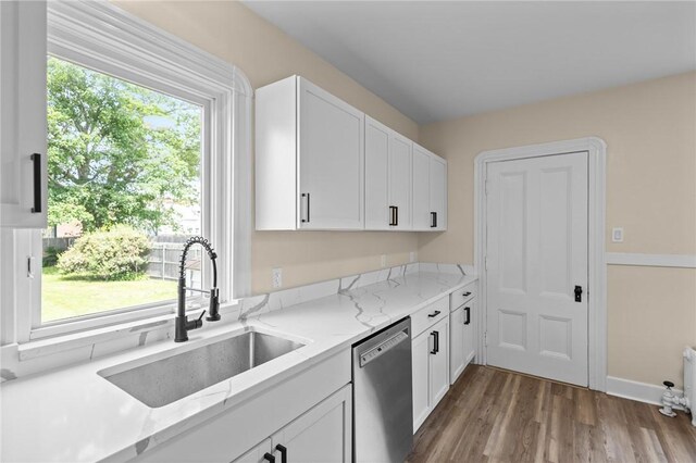 62 Fenner Ave, East Providence, RI 02915 - kitchen featuring dishwasher, a sink, and white cabinetry