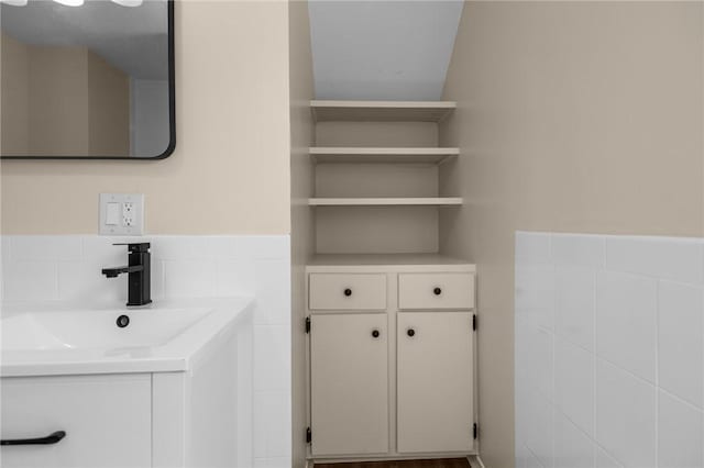 62 Fenner Ave, East Providence, RI 02915 - bathroom with tile walls and vanity