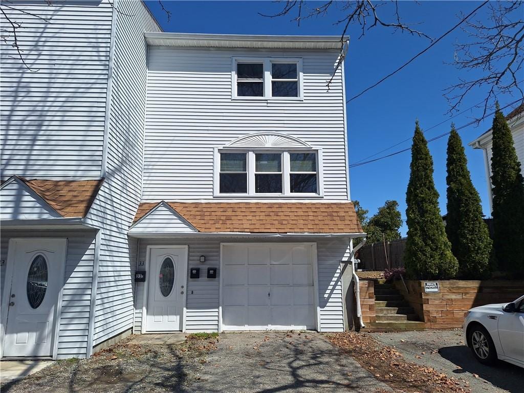 33 Yorkshire St Unit C, Providence, RI 02908 - multi unit property featuring a garage, a shingled roof, and asphalt driveway
