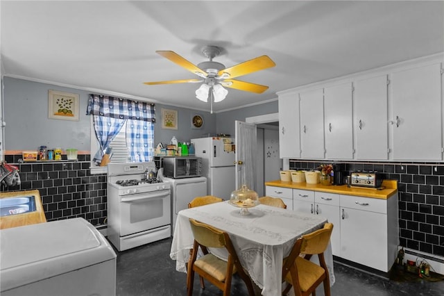 43 Dexter St, Woonsocket, RI 02895 - kitchen with white appliances, white cabinets, ornamental molding, concrete flooring, and a ceiling fan