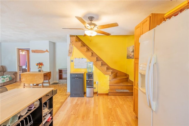 79 George Waterman Rd, Johnston, RI 02919 - kitchen featuring white fridge with ice dispenser, a ceiling fan, baseboards, and light wood-style floors