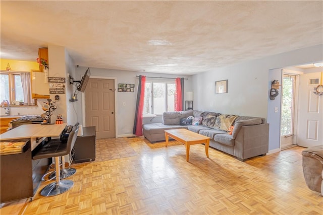 79 George Waterman Rd, Johnston, RI 02919 - living room with healthy amount of natural light and baseboards