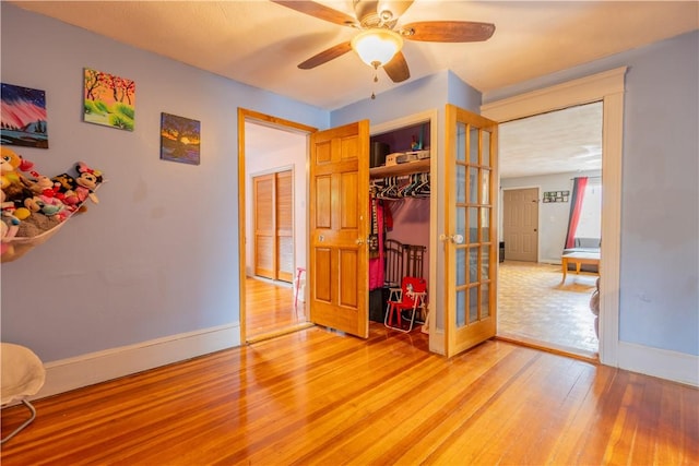 79 George Waterman Rd, Johnston, RI 02919 - bedroom featuring french doors, light wood finished floors, baseboards, and a closet