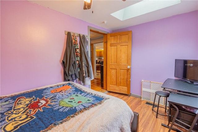 79 George Waterman Rd, Johnston, RI 02919 - bedroom with a skylight, light wood-type flooring, and ceiling fan