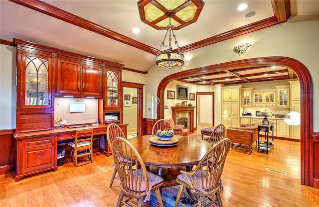45 Burns Way E, Greenwich, RI 02818 - dining room featuring arched walkways, crown molding, light wood-type flooring, wainscoting, and a desk