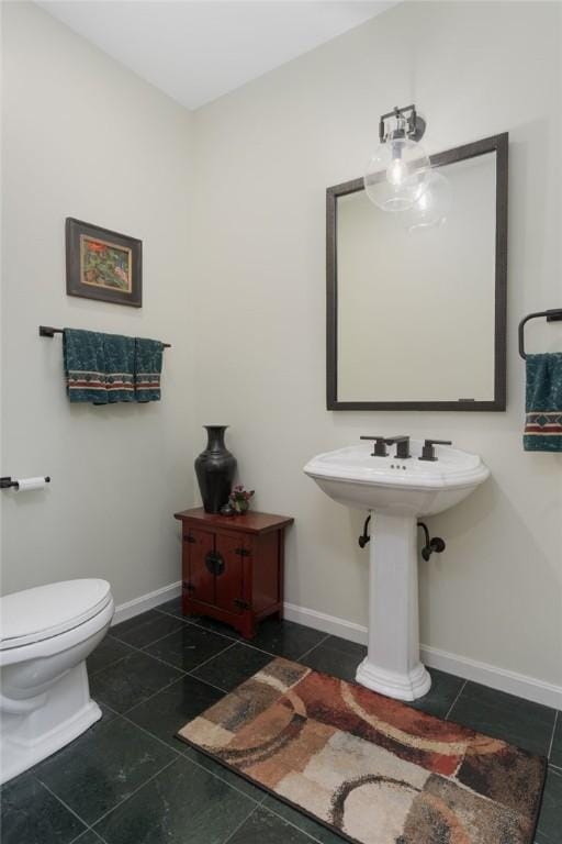 95 Pheasant Dr, East Greenwich, RI 02818 - half bath with tile patterned flooring, toilet, and baseboards