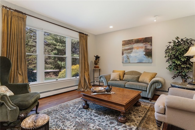 95 Pheasant Dr, East Greenwich, RI 02818 - living area featuring baseboard heating, wood finished floors, and recessed lighting