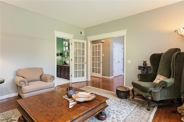 95 Pheasant Dr, East Greenwich, RI 02818 - living area featuring wood finished floors, baseboards, and french doors