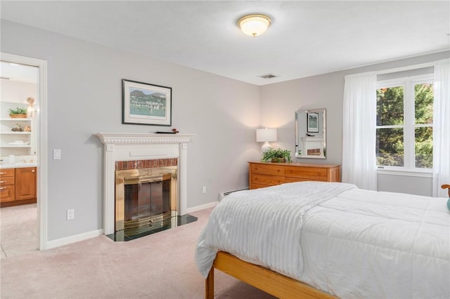 95 Pheasant Dr, East Greenwich, RI 02818 - bedroom featuring light carpet, baseboard heating, a fireplace, and baseboards