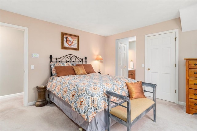 95 Pheasant Dr, East Greenwich, RI 02818 - bedroom with light carpet, baseboards, and connected bathroom