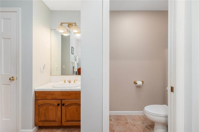 95 Pheasant Dr, East Greenwich, RI 02818 - bathroom with vanity, toilet, baseboards, and tile patterned floors