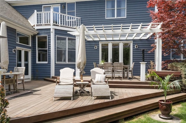 95 Pheasant Dr, East Greenwich, RI 02818 - wooden deck with outdoor dining space and a pergola