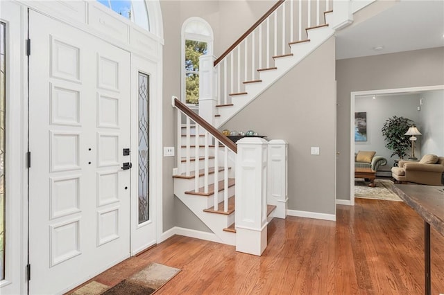 95 Pheasant Dr, East Greenwich, RI 02818 - foyer entrance with wood finished floors, stairway, and baseboards