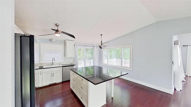 370 Ring Ave, Warwick, RI 02888 - kitchen with appliances with stainless steel finishes, lofted ceiling, dark countertops, a sink, and dark wood-style flooring