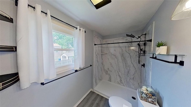 370 Ring Ave, Warwick, RI 02888 - bathroom featuring a marble finish shower, wood finished floors, toilet, and baseboards