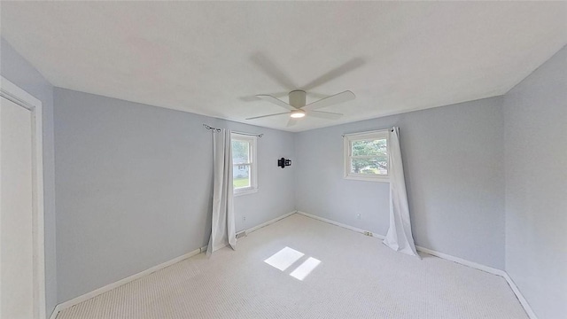 370 Ring Ave, Warwick, RI 02888 - spare room featuring light colored carpet, ceiling fan, and baseboards
