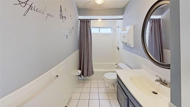 370 Ring Ave, Warwick, RI 02888 - bathroom featuring toilet, vanity, shower / bath combo, a wainscoted wall, and tile patterned floors