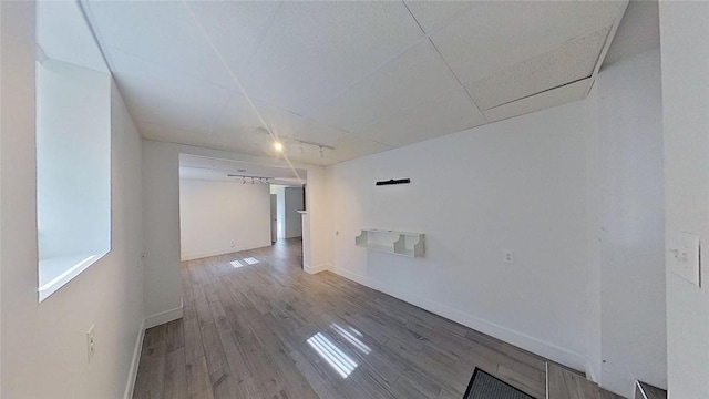 370 Ring Ave, Warwick, RI 02888 - spare room featuring wood finished floors, baseboards, and a drop ceiling