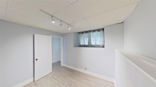 370 Ring Ave, Warwick, RI 02888 - empty room with rail lighting, wood finished floors, and baseboards