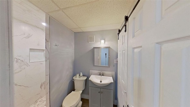 370 Ring Ave, Warwick, RI 02888 - bathroom with a marble finish shower, vanity, toilet, and a paneled ceiling