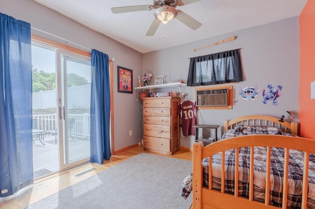 254 Jenckes St, Woonsocket, RI 02895 - bedroom featuring access to outside, wood finished floors, baseboards, a ceiling fan, and cooling unit