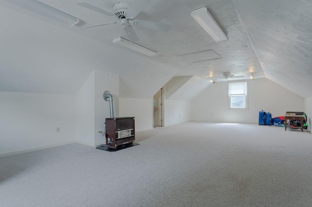 254 Jenckes St, Woonsocket, RI 02895 - additional living space with a wood stove, vaulted ceiling, ceiling fan, and carpet