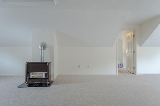 254 Jenckes St, Woonsocket, RI 02895 - bonus room with carpet flooring, baseboards, vaulted ceiling, and a wood stove