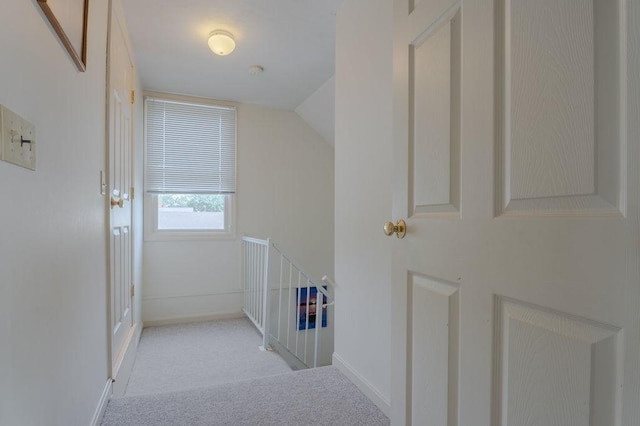 254 Jenckes St, Woonsocket, RI 02895 - hall with carpet flooring, an upstairs landing, vaulted ceiling, and baseboards