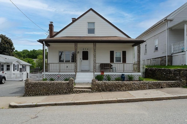 254 Jenckes St, Woonsocket, RI 02895 - view of front of property featuring a porch and a chimney