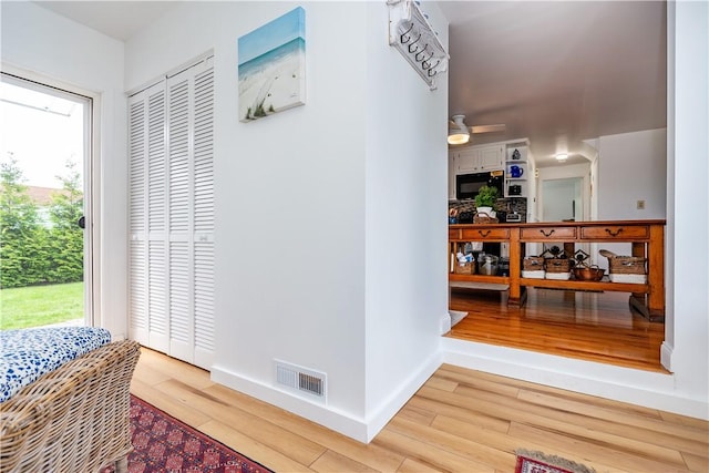 170 Pilgrim Pkwy, Warwick, RI 02888 - hallway featuring wood finished floors, healthy amount of natural light, and baseboards