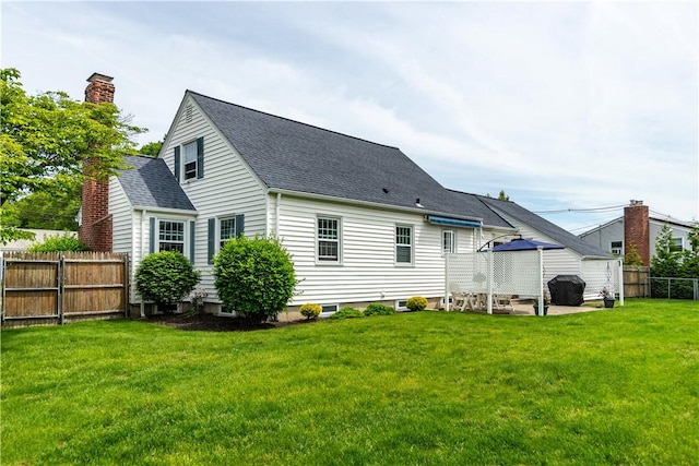 170 Pilgrim Pkwy, Warwick, RI 02888 - back of property with a chimney and a shingled roof