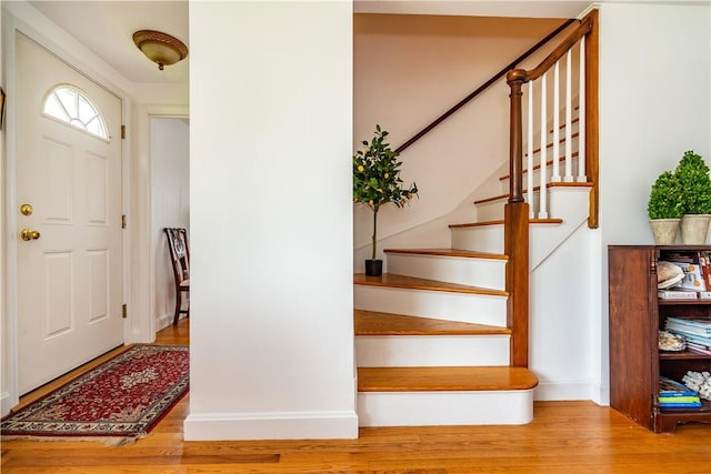 170 Pilgrim Pkwy, Warwick, RI 02888 - entryway with wood finished floors, stairway, and baseboards