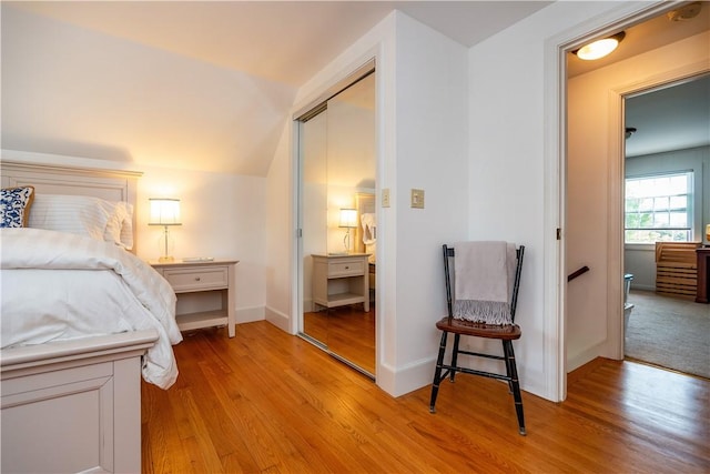 170 Pilgrim Pkwy, Warwick, RI 02888 - bedroom with light wood finished floors, lofted ceiling, and baseboards