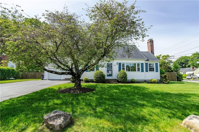 170 Pilgrim Pkwy, Warwick, RI 02888 - view of front of house with a chimney and a garage