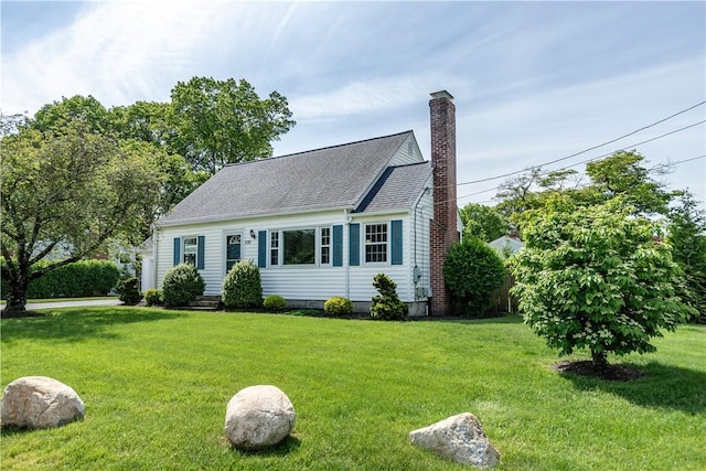 170 Pilgrim Pkwy, Warwick, RI 02888 - cape cod-style house featuring a chimney, a front lawn, and roof with shingles