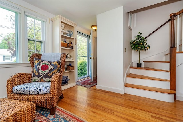 170 Pilgrim Pkwy, Warwick, RI 02888 - sitting room featuring light wood-style flooring, stairway, and baseboards
