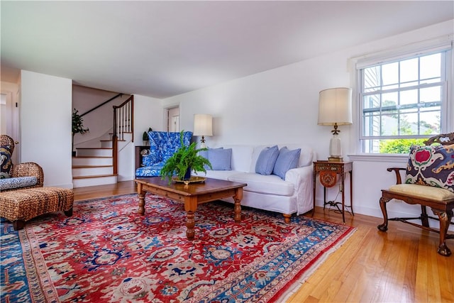 170 Pilgrim Pkwy, Warwick, RI 02888 - living room with wood finished floors, stairs, and baseboards
